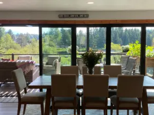 View from dining room through new Nano Door to their private lake.