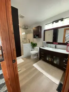 Completed bathroom in new location on main level.