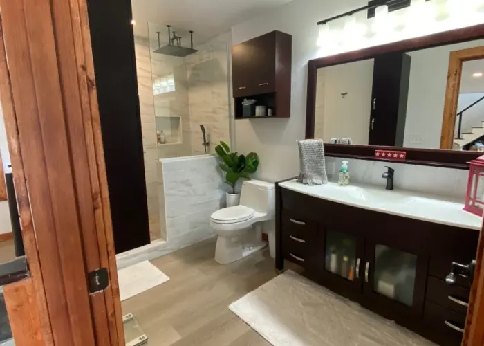 Completed bathroom in new location on main level.